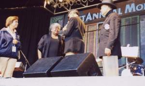 With tears of joy, Dorothy receives the first ever Lifetime Achievement award from Director Lee Durley of the Monterey Bay Blues Festival.  Director Julie Paisant and KGO radio personality Ray Taliaferro watch the presentation.  Also, unveiled after the June 24 performance was a large painting of Dorothy Moore.